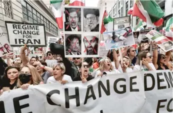  ?? RICHARD VOGEL/AP ?? Demonstrat­ors shout Saturday during a protest against the Iranian regime in Los Angeles.