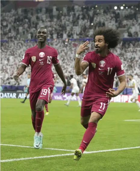  ?? AP ?? Qatar’s Akram Afif celebrates after scoring his hat-trick goal against Jordan in the Asian Cup final at Lusail Stadium on Saturday