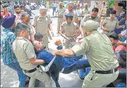  ?? RAVI KUMAR/ HT ?? Police try to stop protesters from entering the MLA Complex, in Chandigarh on Monday.