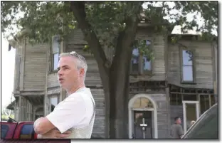  ??  ?? Tony Curtis stands in front of his house in 2005 after a press conference was canceled. The city had planned to install a sign in front of the house declaring it part of the “Project Shame” initiative.