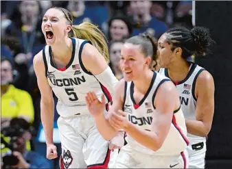  ?? JESSICA HILL/AP PHOTO ?? UConn guard Paige Bueckers (5) reacts in the first half of Sunday’s Big East Conference tournament semifinal against Marquette at Mohegan Sun Arena.