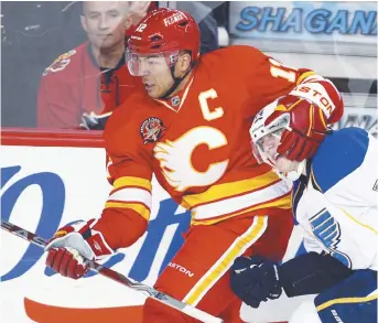  ?? - Archives ?? Jarome Iginla (12) a porté l’uniforme des Flames de Calgary pendant 16 des 20 saisons qu’il a jouées dans la LNH.