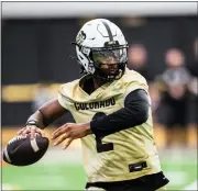  ?? CU ATHLETICS — COURTESY PHOTO ?? Colorado quarterbac­k Shedeur Sanders throws a pass during spring practice on Wednesday.