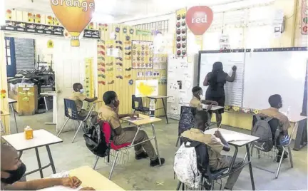  ??  ?? Grade 6 teacher Shelika Walker conducts a class at Green Island Primary School yesterday.