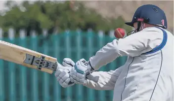  ??  ?? Ian Wilson lashes out during Staithes’ stunning innings