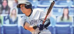  ?? Mike Carlson / Associated Press ?? The New York Yankees’ Gio Urshela follows through on his two-run single against the Toronto Blue Jays during the fourth inning on Wednesday.