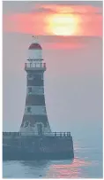  ??  ?? DAWN Sun over Roker lighthouse