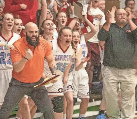  ?? STEVE DAVIS/WCI SPORTS ?? Lewistown assistant coach Joey McLaughlin (left) and head coach Greg Bennett (far right) celebrate on the Lewistown bench during a game.