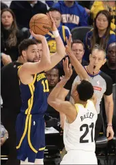  ?? RAUL EBIO – SANTA CRUZ SENTINEL ?? Warriors guard Klay Thomposon scores on a 3-pointer against Utah Jazz forward Darius Bazley during the second quarter at Chase Center in San Francisco on Sunday.