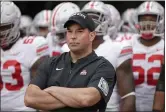  ?? NATI HARNIK — THE ASSOCIATED PRESS ?? Coach Ryan Day and Ohio State wait to take the field against Nebraska on Sept. 28.