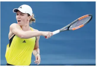  ??  ?? Simona Halep of Romania returns a shot to Anastasija Sevastova of Latvia during Day 6 of the Western and Southern Open at the Linder Family Tennis Center on Thursday in Mason, Ohio. (AFP)