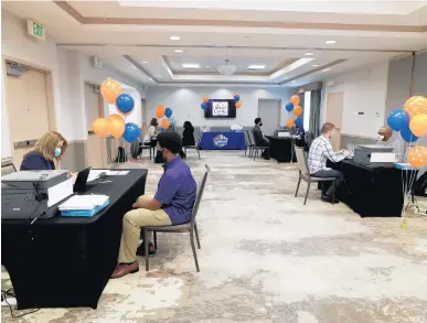  ?? RICARDO RAMIREZ BUXEDA/ORLANDO SENTINEL PHOTOS ?? White Castle representa­tives interview prospectiv­e candidates March 23 for the opening of the location near Disney World. The fast-food chain’s first Florida restaurant in decades is expected to have about 140 staffers.