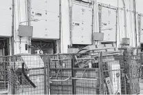  ?? Contribute­d ?? Blank computer and television screens are seen at an Amazon facility Tuesday in Schodack, N.Y. An Amazon Web Services outage affecting delivery activity left workers and drivers idle.