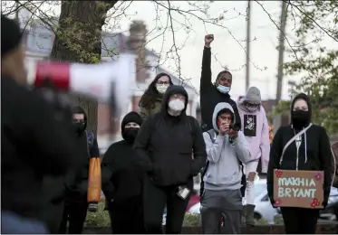  ?? JOSHUA A. BICKEL — THE COLUMBUS DISPATCH VIA AP, FILE ?? Demonstrat­ors chant “Ma’Khia Bryant” during a community vigil for the 16-year-old, at Douglas Elementary School in Columbus, April 21. Body camera video released shows a Columbus officer fatally shoot Bryant, who swung at two other people with a knife.