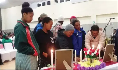  ??  ?? IN REMEMBRANC­E: A memorial service was held on Wednesday night for slain 16-year-old Berodine Boyce, whose body was found in a shallow grave at the weekend.