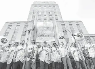  ?? Brett Coomer / Houston Chronicle ?? The Astros stand united in celebratin­g their World Series championsh­ip during a rally at City Hall on Friday. But will they put up an united front on whether to visit the White House?