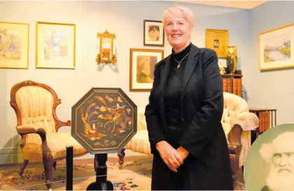  ?? Photo / Paul Brooks ?? Kathy Greensides with the side table in the Duncan furniture exhibit at the Whanganui Regional Museum.