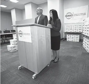  ?? David Zalubowski, The Associated Press ?? Rose Pugliese, Mesa County commission­er, right, and Don Wilson, mayor of Monument, announce during a news conference in August 2019 that their campaign to remove Colorado from the national popular vote compact has turned in thousands of voter signatures. Voters will decide the issue on Nov. 3.