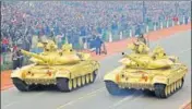  ??  ?? Army tanks pass through the saluting base during the full dress rehearsal for Republic Day Parade at Rajpath. HINDUSTAN TIMES