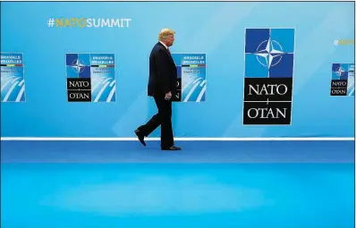  ?? AP/PABLO MARTINEZ MONSIVAIS ?? President Donald Trump arrives for an introducti­on at a gathering of the leaders of NATO nations in Brussels on Wednesday, a day when he called Germany “a captive of Russia” during a breakfast meeting.