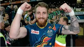  ?? SPORTSFILE ?? Test of character: Zach Tuohy celebrates after the second Internatio­nal Rules Test in Croke Park in 2013