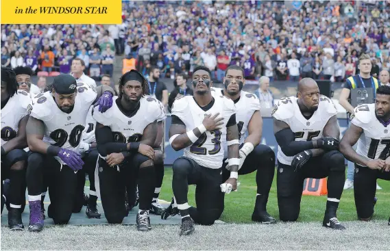  ?? MATT DUNHAM / THE ASSOCIATED PRESS ?? Baltimore Ravens players kneel during the U.S. national anthem before an NFL game against the Jacksonvil­le Jaguars at Wembley Stadium in London on Sunday.