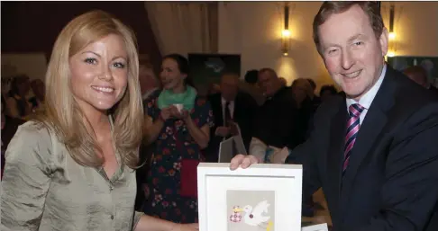  ??  ?? An Taoiseach Enda Kenny pictured with Louise Harte, Once Upon a Time Crafts at the Sligo Leader Showcase in the Sligo Park Hotel last Friday evening. Pics: Carl Brennan.