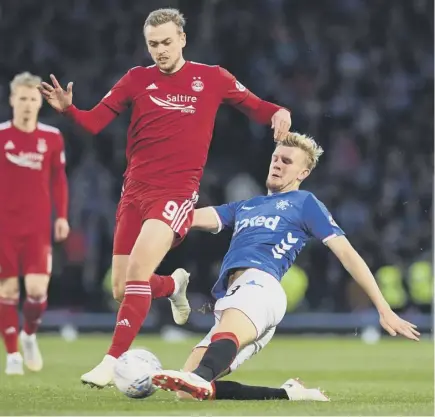  ??  ?? 2 Rangers defender Joe Worrall, sliding into a challenge on James Wilson, acknowledg­ed that Steven Gerrard’s side weren’t clinical enough against Aberdeen at Hampden and that their opponents had got their tactics spot on.