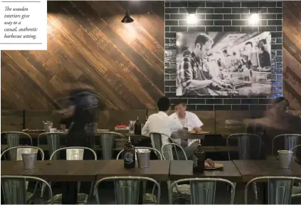 ??  ?? The wooden interiors give way to a casual, authentic barbecue setting.