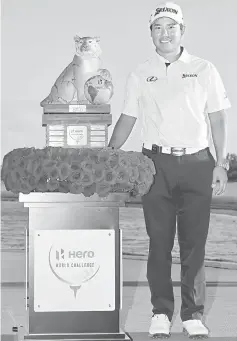  ??  ?? Hideki Matsuyama poses with the trophy after winning the Hero World Challenge at Albany, The Bahamas in Nassau, Bahamas. — AFP photo