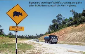  ??  ?? Signboard warning of wildlife crossing along the Jalan Bukit Beruntung/Shah Alam Highway.