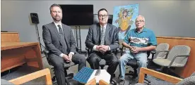  ?? JOHN RENNISON THE HAMILTON SPECTATOR ?? Justice Gethin Edward, centre, is flanked by Crown attorney Andrew Falls, left, and Peter Schuler, an Indigenous Knowledge Keeper, right, as they sit in The Circle at the Indigenous People’s Court in Brantford. The specialize­d court opened in January 2014.