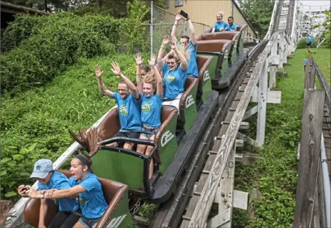  ?? Stephanie Strasburg/Post-Gazette ?? Passengers ride the Jack Rabbit roller coaster in August 2018 at Kennywood Park in West Mifflin. The Jack Rabbit turns 100 this year.