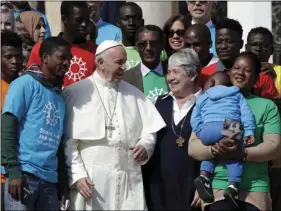 ??  ?? Pope Francis meets a group of migrants, during his weekly general audience, at the Vatican, on Wednesday. Pope Francis on Wednesday launched a two-year activism and awareness-raising campaign about the plight of migrants to counteract mounting...