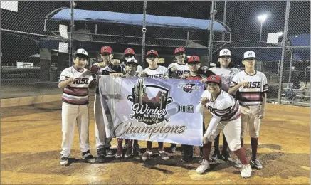  ?? COURTESY PHOTO ?? The RISE Baseball 13U team holds up its championsh­ip banner after winning the Winter Nationals Warm Up tournament Dec. 21 in Phoenix, Ariz.