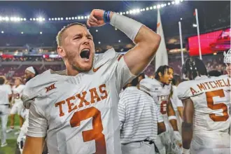  ?? AP PHOTO/VASHA HUNT ?? Texas quarterbac­k Quinn Ewers (3) celebrates the team’s win at Alabama on Saturday night.