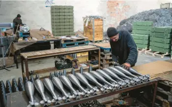  ?? EVGENIY MALOLETKA/AP ?? A worker assembles mortar rounds Jan. 31 at a factory in Ukraine, which has ramped up its output.
