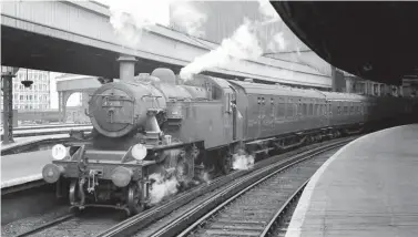  ?? Colour-Rail.com/12113 ?? Ivatt ‘2MT’ 2-6-2T No 41298 was transferre­d from Weymouth to Nine Elms in October 1966 and it remained in service until the final day of Southern Region steam – Sunday, 9 July 1967. It is captured in this period at London (Waterloo) while waiting to work empty coaching stock to Clapham Junction yard, which was its bread and butter work. The distinctly different looking chimney – taller, thinner and slightly tapered – stands out in this view; it was only fitted to Nos 41290-99. In addition, locomotive­s from No 41290 also had the round eave cab profile and the later pattern pony truck with integral guard irons.