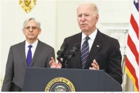  ?? Kevin Dietsch / Getty Images ?? President Biden joined Attorney General Merrick Garland at the White House to talk about rising crime. He outlined new measures to curb gun violence.