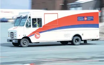  ?? KEITH GOSSE/THE TELEGRAM FILE PHOTO ?? Canada Post says it’s processing and delivering parcels at levels only experience­d during the busiest weeks of the Christmas season.