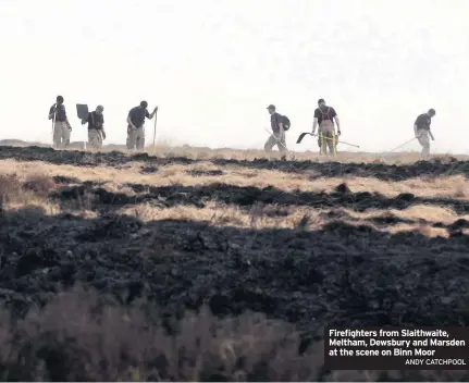  ??  ?? Firefighte­rs from Slaithwait­e, Meltham, Dewsbury and Marsden at the scene on Binn Moor