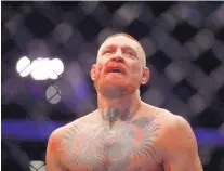  ?? ISAAC BREKKEN/ASSOCIATED PRESS ?? Conor McGregor gained a measure of revenge against Nate Diaz on Saturday, winning by majority decision at UFC 202.