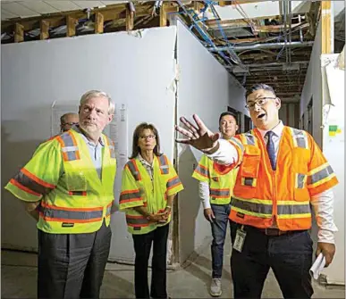  ?? THE CALIFORNIA­N FILE ?? Assistant to the City Manager Anthony Valdez, right, explains the work being done at the Brundage Lane Navigation Center to, from left, Ward 3 City Councilman Ken Weir, Ward 6 Councilwom­an Patty Gray and Ward 1 Councilman Eric Arias, during a tour of the center in 2022 given to the Ad Hoc Committee on Homelessne­ss.