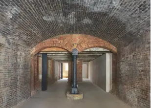  ??  ?? below, one of the storage spaces into Which coal WAS once dropped from Wagons on railway tracks Above. the brick And cast-iron Arches Will soon reopen, occupied by shops, cafés And restaurant­s