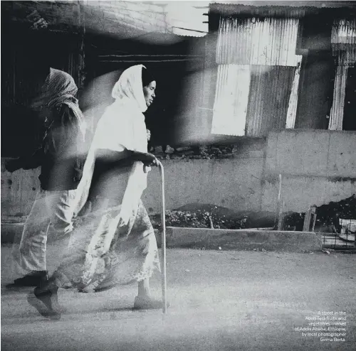  ??  ?? A street in the Atkilt Tera fruits and vegetables market of Addis Ababa, Ethiopia, by local photograph­er Girma Berta.