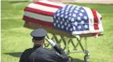  ?? ROB SCHUMACHER/THE REPUBLIC ?? A fellow officer attends services for Peoria Police officer Jason Judd.