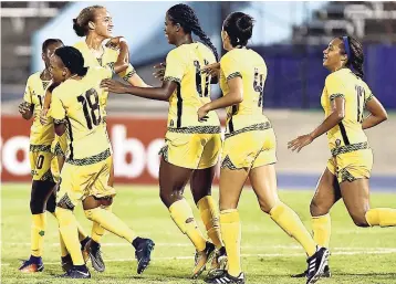  ??  ?? Members of Jamaica’s Reggae Girlz team celebrate a goal during their 4-1 win over Trinidad and Tobago at the CONCACAF Caribbean Women’s Qualifiers at the National Stadium in August.