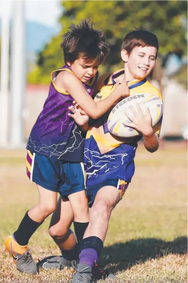  ?? Picture: BRENDAN RADKE ?? ALL IN THE GAME: Edmonton Storm junior Slayter McGrath tackles Jaxson Rayson in the same manner Billy Slater tackled Sosaia Feki.