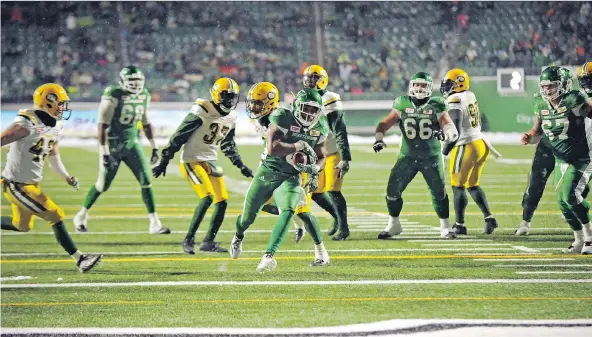  ?? THE CANADIAN PRESS ?? Marcus Thigpen, shown scampering for a TD against the Eskimos last season, has been suspended for two games for violating the CFL/CFLPA drug policy.