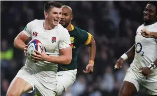  ??  ?? Smiling assassin: Owen Farrell runs in England’s fourth try